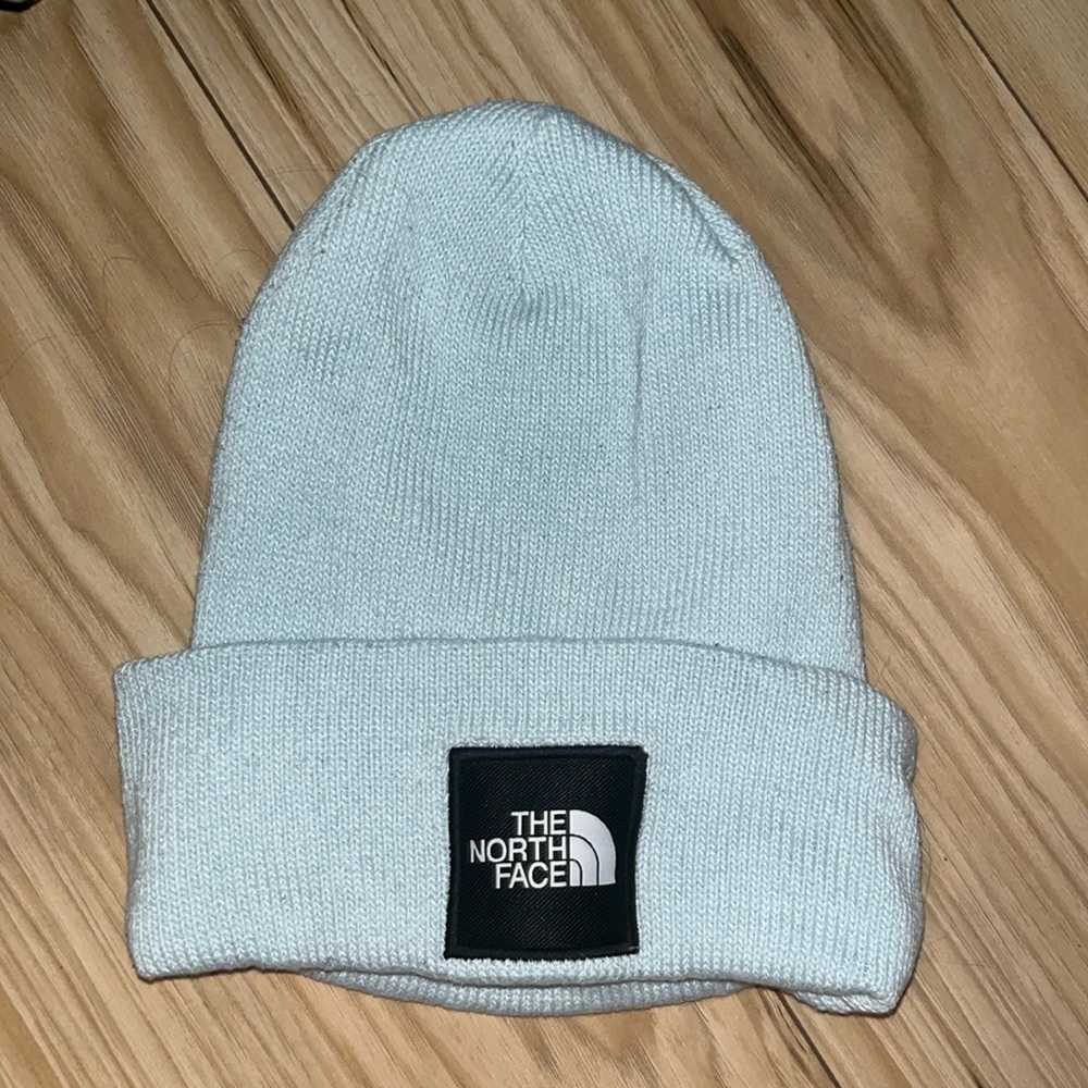 Only worn once , perfect condition, blue and black north face beanie
